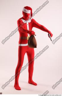 JOEL_ADAMSON CHRISTMAS VALLAIN WITH GUN AND BAG